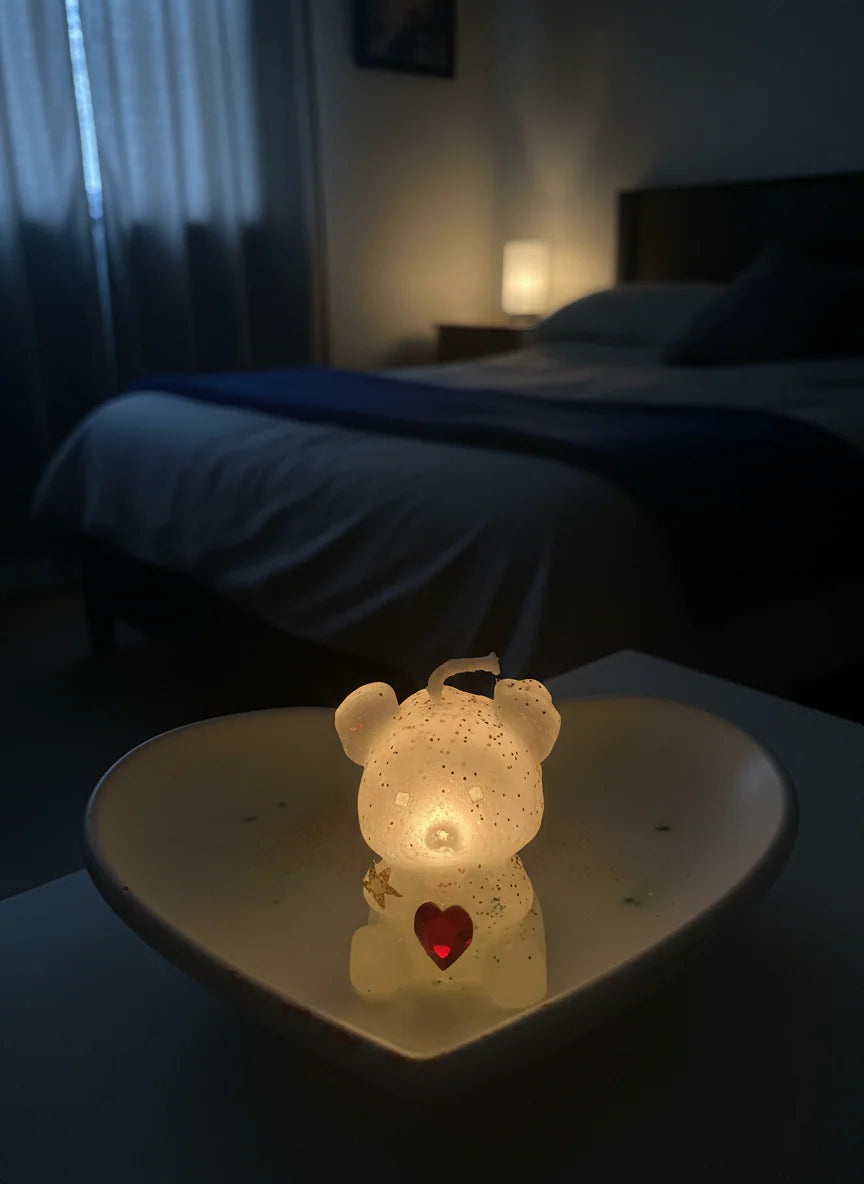 heart shape holder on a table in a dimly lit room.